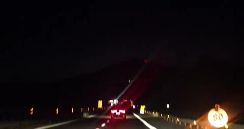 Beautiful view of Mount Etna at night while driving on the highway Stock Footage 317442291