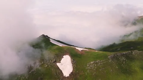 Beautiful view of the mountain in the clouds drone shot Stock Footage 298536018