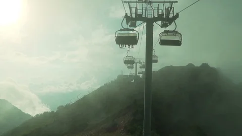 Beautiful View Of Mountain peaks Cable Cabins Passing By Sunrise Golden Colour Vidéo 121580287