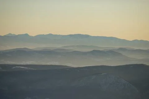 Beautiful view of the mountain range partially covered with snow just before  Stock Photos