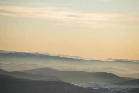 Beautiful view of the mountain range partially covered with snow just before  Stock Photos