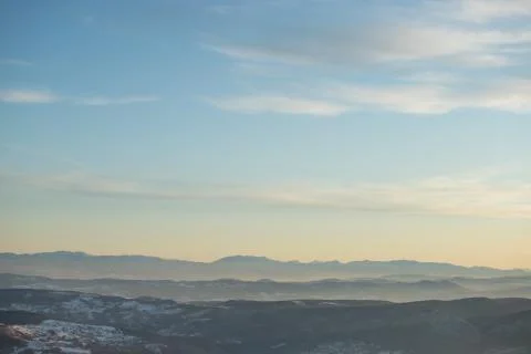 Beautiful view of the mountain range partially covered with snow just before  Stock Photos
