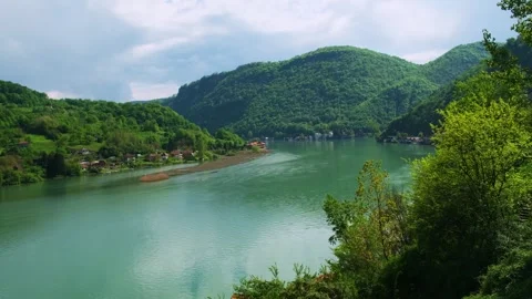 Beautiful view of mountain river and small village from the observation deck. Stock-Footage 241128611