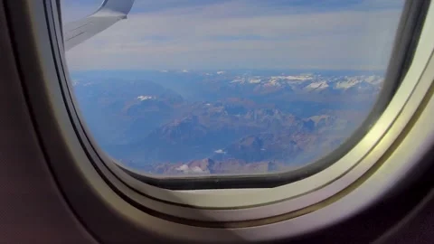 A Beautiful View of the Mountains From Above Through the Clouds. Stock Footage 223668373