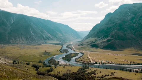Beautiful view of the mountains and the river. Lowland with houses. Altai Video stock 165967280