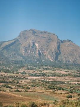 Beautiful view of mountains fields blue sky and clouds in Sicily Stock Photos