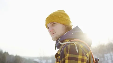 A beautiful view of the mountains in winter. A Young Man is Walking Up Mountain Stock Footage 101027963