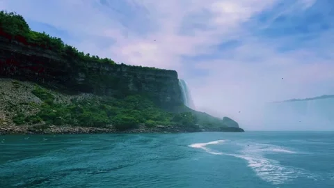 Beautiful View of Niagara Falls From Canada Side, River cascading over the .. Stock Footage 256574205