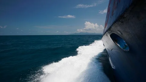 Beautiful view from the nose of a floating high-speed ship cutting water and sea Stock Footage 89410198