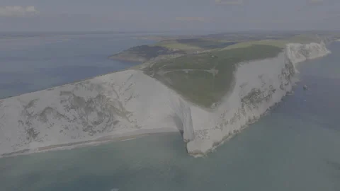 A beautiful view of the ocean with a cliff in the background Stock Footage 298283020