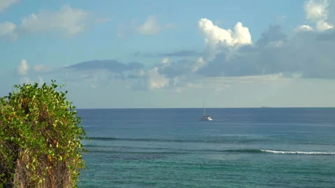 Beautiful view of the ocean with clouds with a boat floating in the distance Video stock 111362652