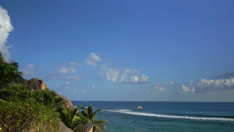 Beautiful view of the ocean with clouds with a boat floating in the distance 스톡 동영상 111363982