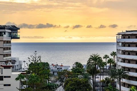 A beautiful view of the ocean with a sunset in the background Stock Photos