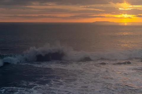 Beautiful view of the ocean waves chasing in rocks Stock Photos