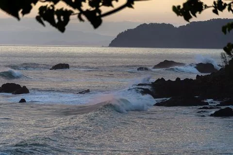 Beautiful view of the ocean waves chasing in rocks Stock Photos
