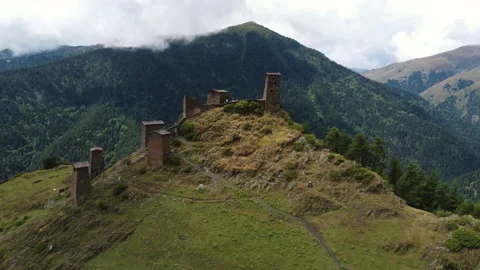 Beautiful view of old ruins of monastery on a hill in Caucasus Mountains Stock Footage 229880607