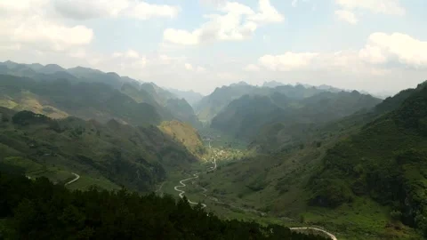 Beautiful view over a valley with multiple layers of mountains in the background Video stock 313798332