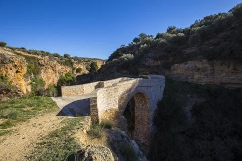 A beautiful view of the Pena Cortada Bridge under the blue sky captured in Ch Stock Photos