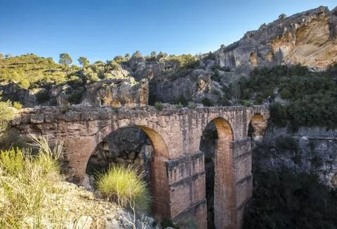 A beautiful view of the Pena Cortada Bridge among the mountains captured in C Stock Photos