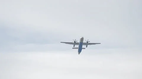 Beautiful view of a plane flying over Innsbruck Stock Footage 61392593