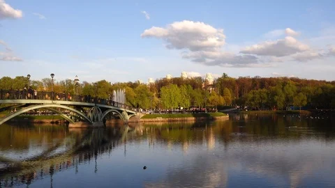 Beautiful view of the pond with a pedestrian bridge in the Tsaritsyno park, Stock Footage 107514361