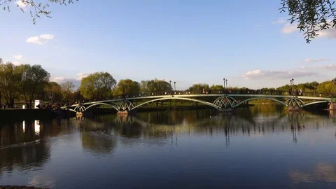 Beautiful view of the pond with a pedestrian bridge in the Tsaritsyno park, Stock Footage 107515778