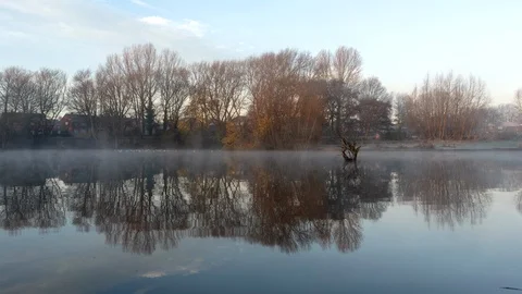 Beautiful view of the pond. Time Lapse over a misty pond during the morning. Stock Footage 99300562