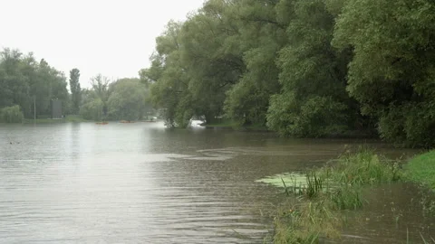 Beautiful view of the river during heavy rain in the city Park  Video stock 125438605