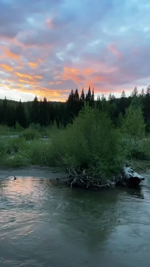 Beautiful view of the river on the edge of the hill with colorful clouds 動画素材 244176928