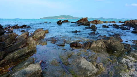 Beautiful view of rocks beach with blue ocean wave. Video stock 152607923