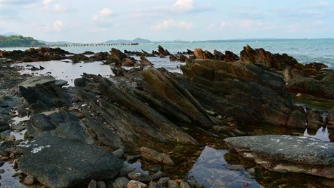 Beautiful view of rocks beach with blue ocean wave. Video stock 152607935