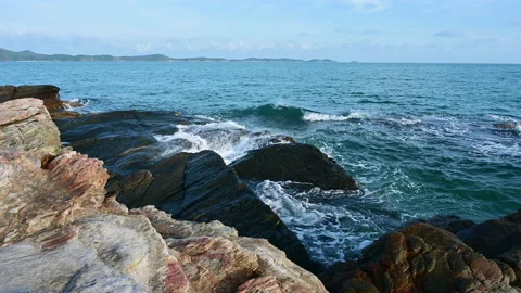 Beautiful view of rocks beach with blue ocean wave. Video stock 152611264