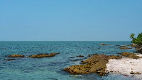 Beautiful view of rocks beach with blue ocean wave. Stock-Footage 154564011