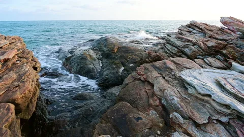 Beautiful view of rocks beach with blue ocean wave. Stock-Footage 155669444