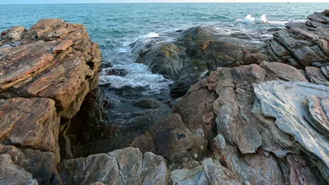 Beautiful view of rocks beach with blue ocean wave. Stock-Footage 155670764
