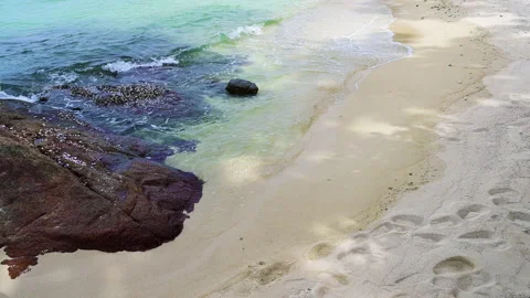 Beautiful view of rocks beach with blue ocean wave. 動画素材 156990601