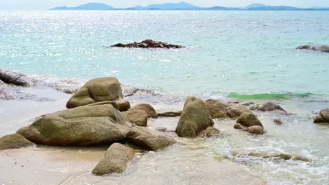 Beautiful view of rocks beach with blue ocean wave. Stock-Footage 156990630
