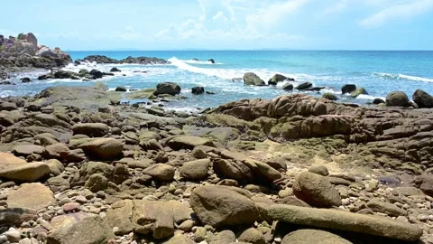 Beautiful view of rocks beach with blue ocean wave. Stock-Footage 157033338