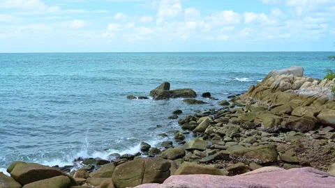 Beautiful view of rocks beach with blue ocean wave. Stock-Footage 157033730
