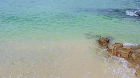 Beautiful view of rocks beach with blue ocean wave. Stock-Footage 158346415