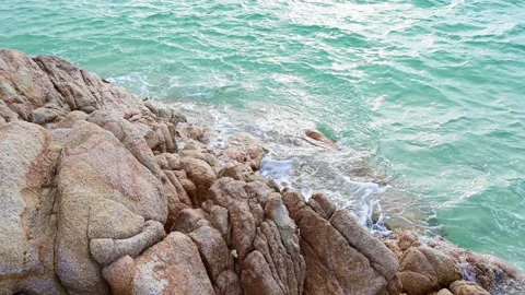 Beautiful view of rocks beach with blue ocean wave. Stock Footage 159200740