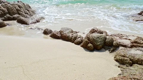Beautiful view of rocks beach with blue ocean wave. Stock Footage 159262105