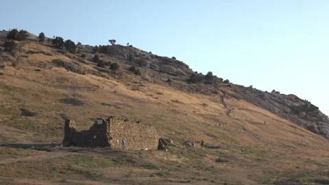 Beautiful view of ruinded castel the mountain at sunset Stock Footage 130438969
