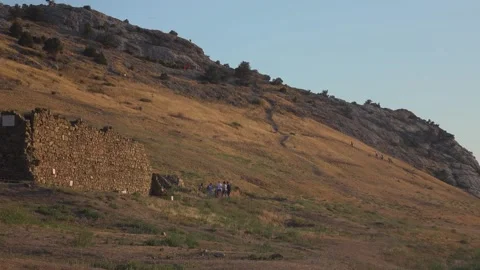 Beautiful view of ruinded castel the mountain at sunset Stock Footage 130438973