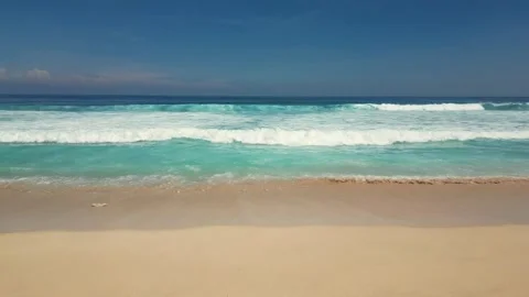 Beautiful view of the sandy beach and the slow waves of the ocean on a sunn.. Stock Footage 287245116