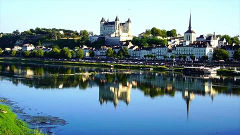 Beautiful view of Saumur Castle reflected on the Loire River, Tilt up Stock Footage 211700007