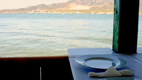 A beautiful view of the sea from the table of a restaurant Stock Footage 100883790