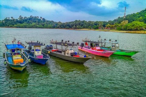 A beautiful view of the sea while seeing many fishing boats at the pier 库存照片
