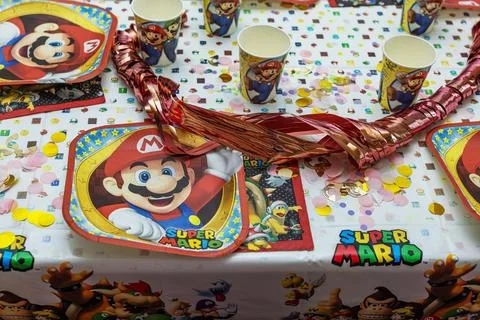 Beautiful view of served table with Mario theme decoration prepared for party. Stock Photos