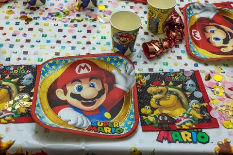 Beautiful view of served table with Mario theme decoration prepared for party Foto stock